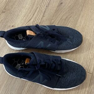 New Balance women’s Navy and White Sneakers